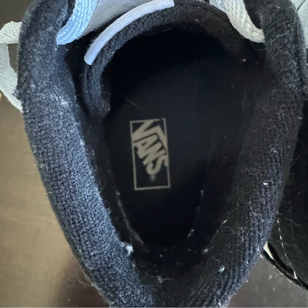Vans Kid’s “Missy” Black and White High-Top Sneakers
